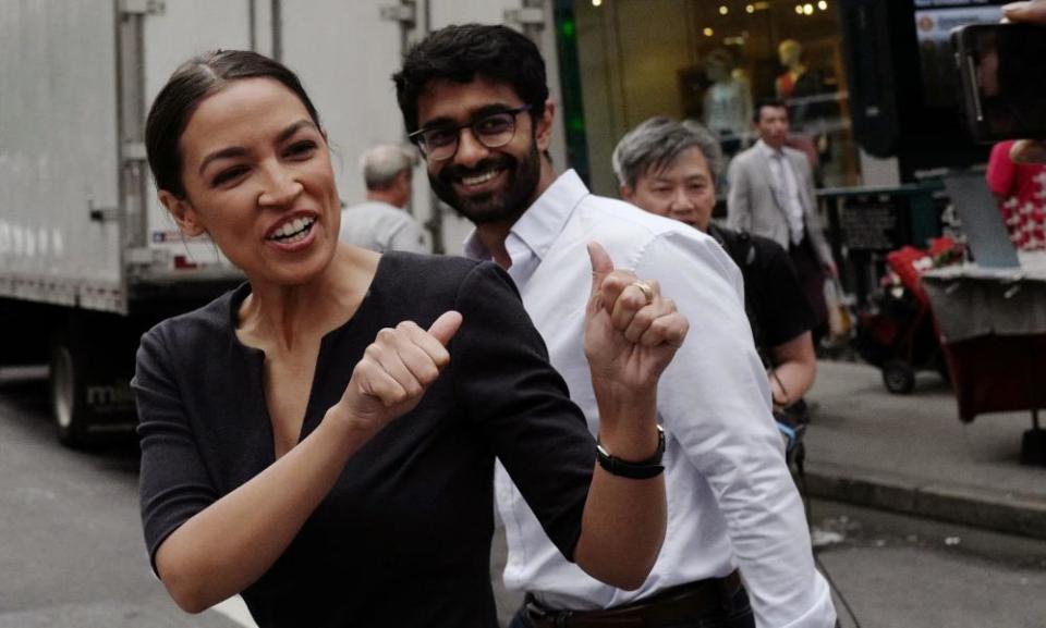 Alexandria Ocasio-Cortez greets a passerby after her victory last week. ‘We’re in the middle of a movement in this country,’ she said after her win.