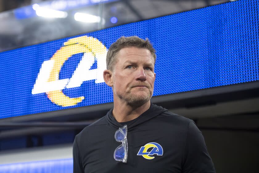 FILE - Los Angeles Rams general manager Les Snead walks on the field before an NFL football game.