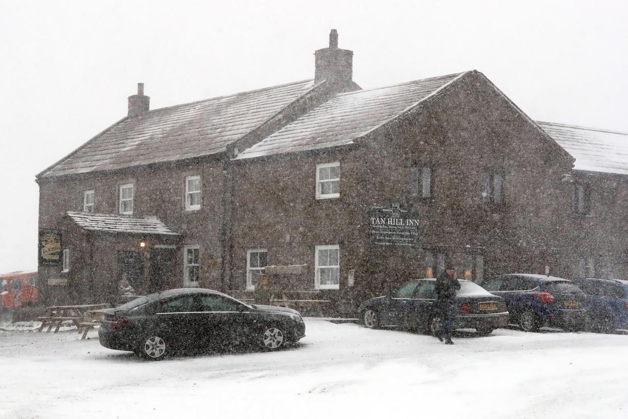 Snow falls at the Tan Hill Inn in North Yorkshire