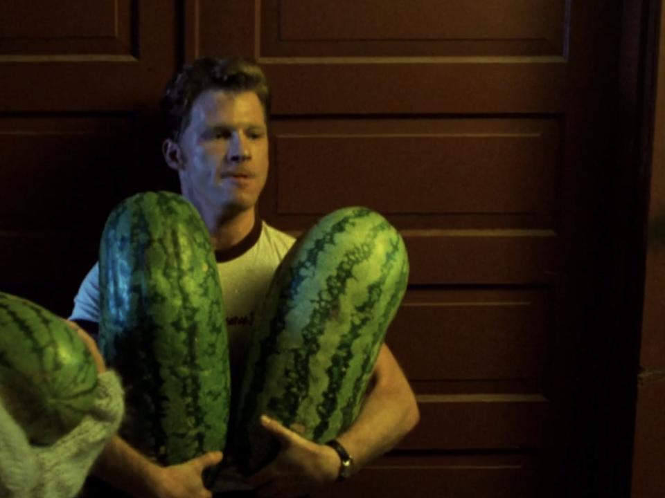 Neal Jones carrying watermelon.