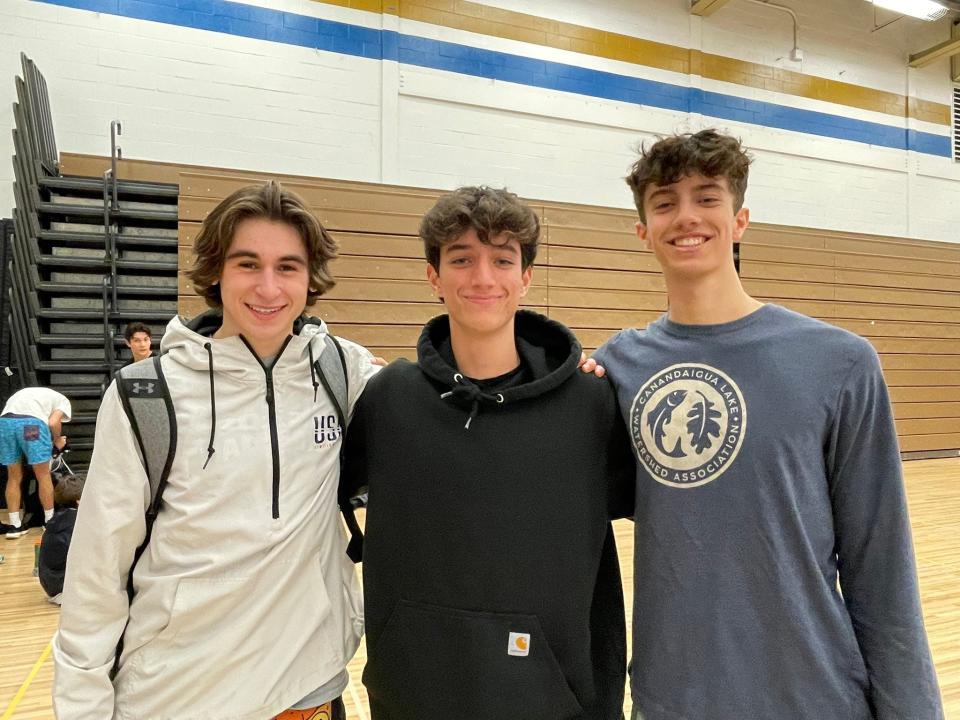 Webster's Joseph Preische, Nicolas Ange and Evan Lukasiewicz prepare for the NYSPHSAA boys volleyball championships Saturday, Nov. 19 in Albany.