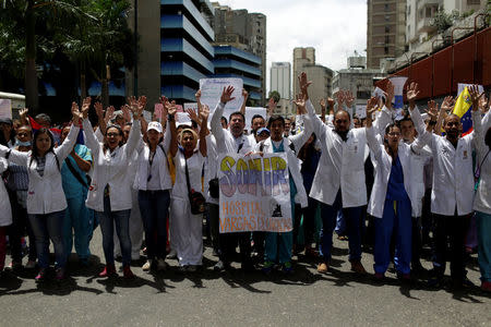 Workers of the health sector and opposition supporters take part in a protest against President Nicolas Maduro's government in Caracas, Venezuela May 17, 2017. REUTERS/Marco Bello