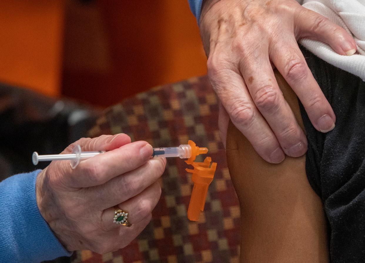 In a file photo,  a child receives a COVID-19 vaccination shot during an open vaccination clinic Jan. 5 in Worcester.