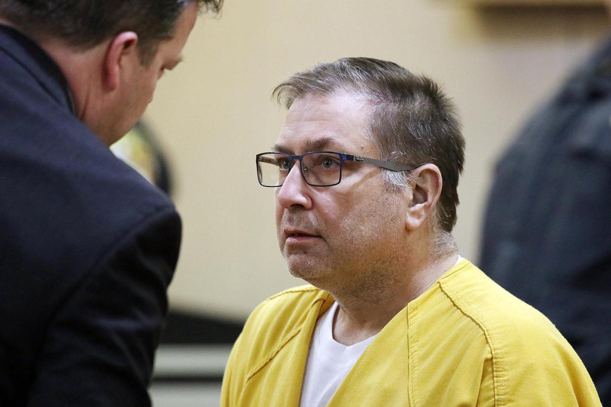 Paul Caneiro speaks to Michael Wicke, deputy assistant public defender, during his arraignment in the murders of his brother and his brother's family, before Judge Joseph W. Oxley at the Monmouth County Courthouse in Freehold, NJ Monday, March 18, 2019. Robert A. Honecker; Jr. and Mitchell J. Ansell, defense attorneys, excused himself from the case due to conflict of interest.