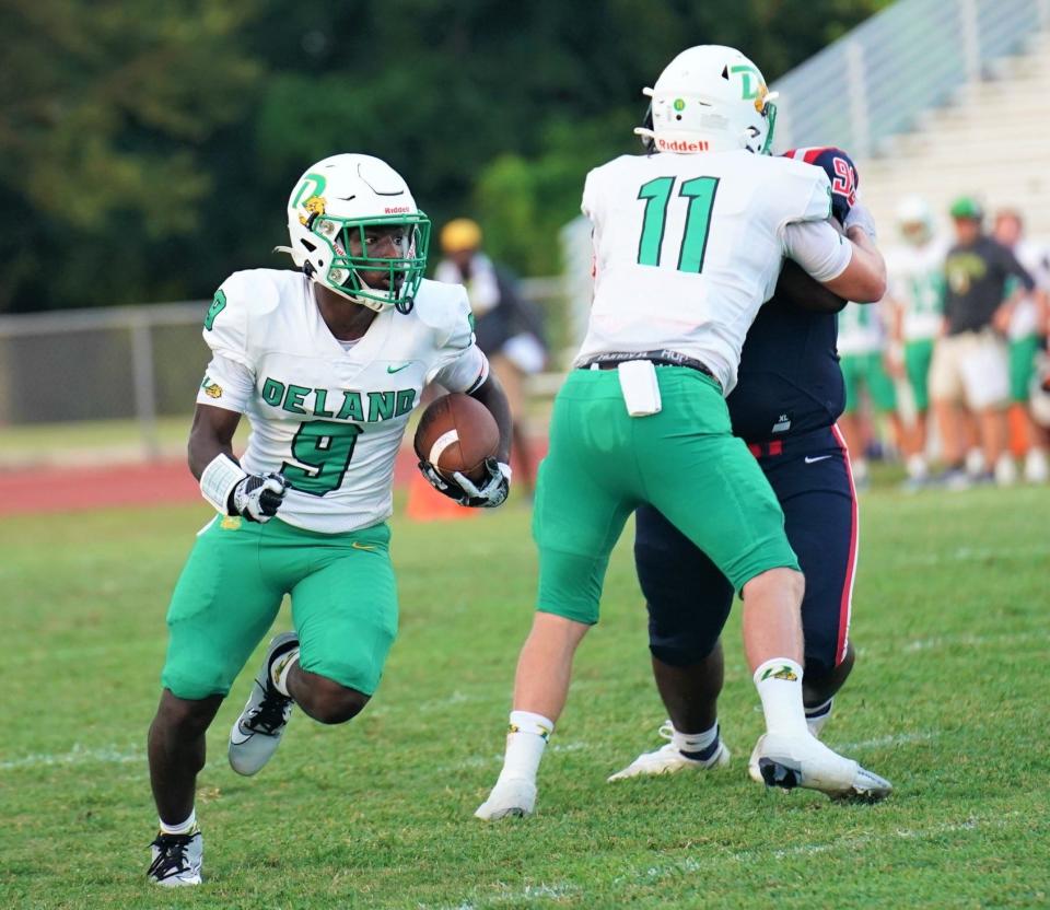 DeLand's Javon Ross (9) looks for running room during DeLand's football game with Centennial on Friday, Sept. 1, 2023. Ross caught two touchdowns against Deltona Friday.