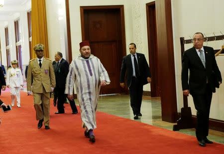 Moroccan King, Mohammed VI (C), arrives at the Great Hall of People for a meeting with China's Premier Li Keqiang (not in picture) in Beijing, China May 12, 2016. REUTERS/Jason Lee