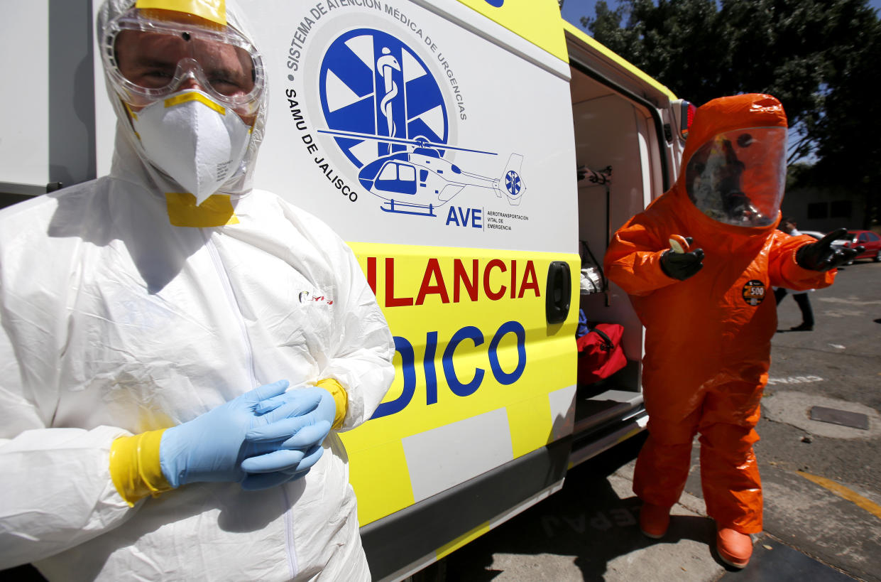 A doctor and a paramedic from the Emergency Medical Care System (SAMU) of Jalisco stand inside the mobile intensive care medical unit the UTIM, the first in Latin America equipped to transfer people infected with the COVID-19 virus in Guadalajara, Jalisco state, Mexico on March 2, 2020. (Photo by Ulises Ruiz / AFP) (Photo by ULISES RUIZ/AFP via Getty Images)