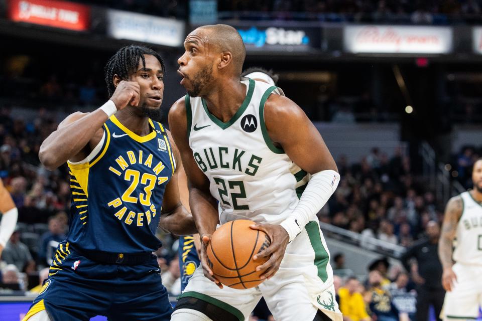 Bucks forward Khris Middleton goes to the basket while Pacers forward Aaron Nesmith defends Wednesday night.