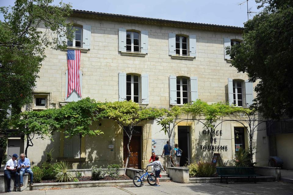 The U.S. flag is displayed on the tourist office of Villeneuve-les-Avignon, in the south of France on June 15, 2019, as former President Barack Obama and his family spends the week in Avignon on vacation.