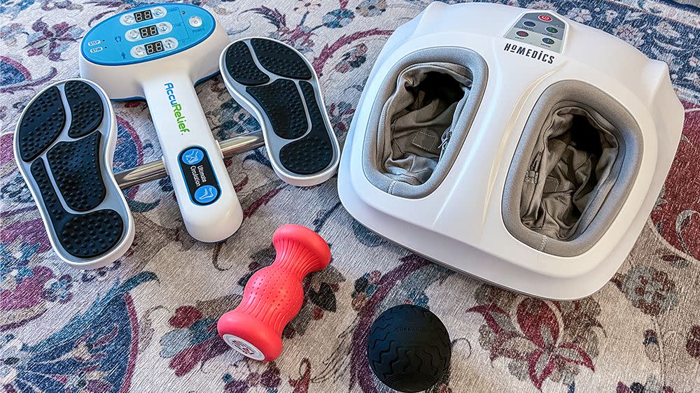 different types of foot massagers laid out on a carpet