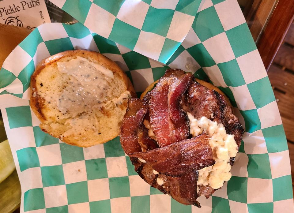 "Naples Pier" burger ($16) at Old Naples Pub with gorgonzola cheese and hardwood-smoked bacon.