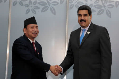 Venezuela's President Nicolas Maduro (R) attends a private meeting with Nanda Kishor Pun, Vice President of Nepal, during the 17th Non-Aligned Summit in Porlamar, Venezuela September 18, 2016. Miraflores Palace/Handout via REUTERS