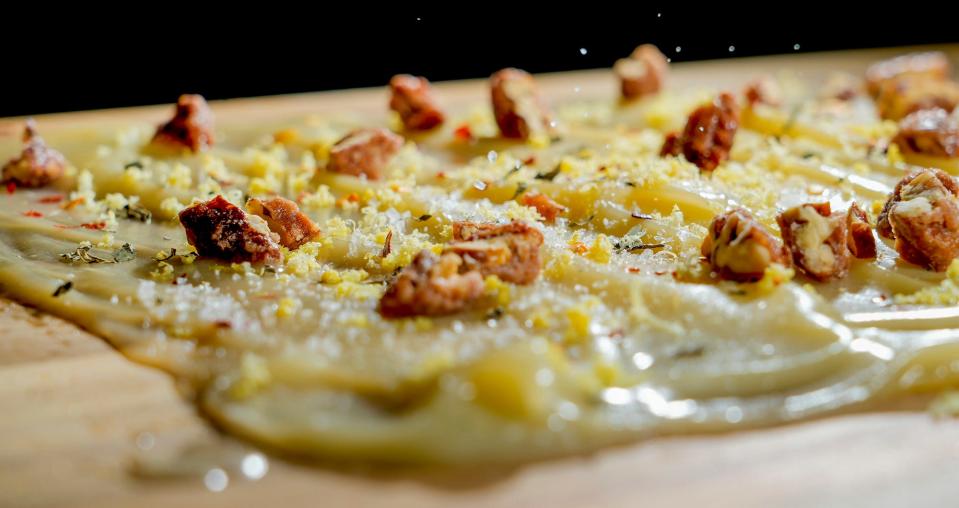 A butter board gets a sprinkling of sea salt.