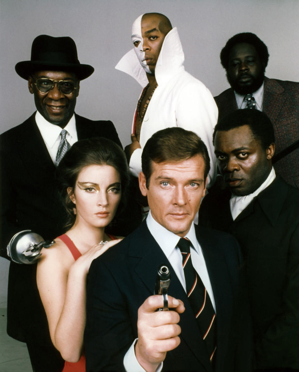 Actors Roger Moore, Yaphet Kotto, Julius W.Harris, Geoffrey Holder, Earl Jolly Brown and actress Jane Seymour, on the set of 