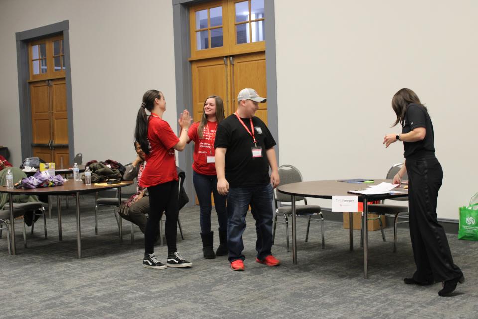 Licking Valley sisters Maya (left) and Taya Sensabaugh celebrate after winning the TECH CORPS Hackathon at Zane State College.