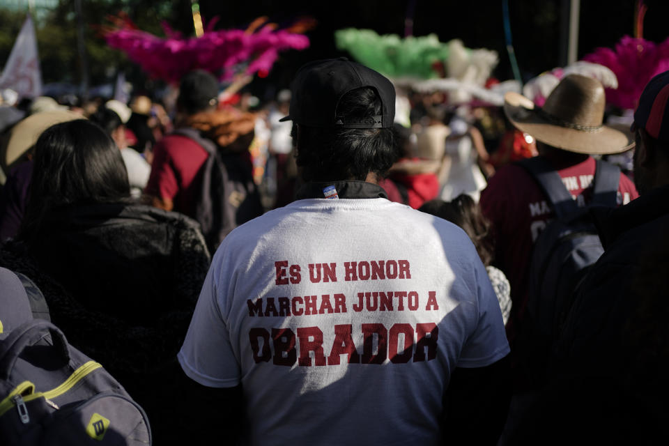 Supporters of Mexican President Andres Manuel Lopez Obrador wait at the Angel of Independence monument prior to a march to support his administration, in Mexico City, Sunday, Nov. 27, 2022. (AP Photo/Eduardo Verdugo)