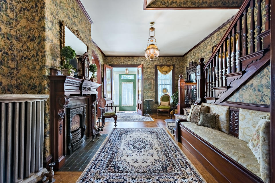 <p>Perhaps you'll be swayed by the six fireplaces with ornate mantels, walnut wainscoting, custom millwork, and inlaid parquet flooring. </p>