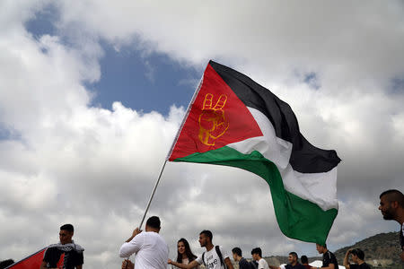 Israeli Arabs take part in a rally calling for the right of return for refugees who fled their homes during the 1948 Arab-Israeli War, near Atlit, Israel April 19, 2018. REUTERS/Ammar Awad