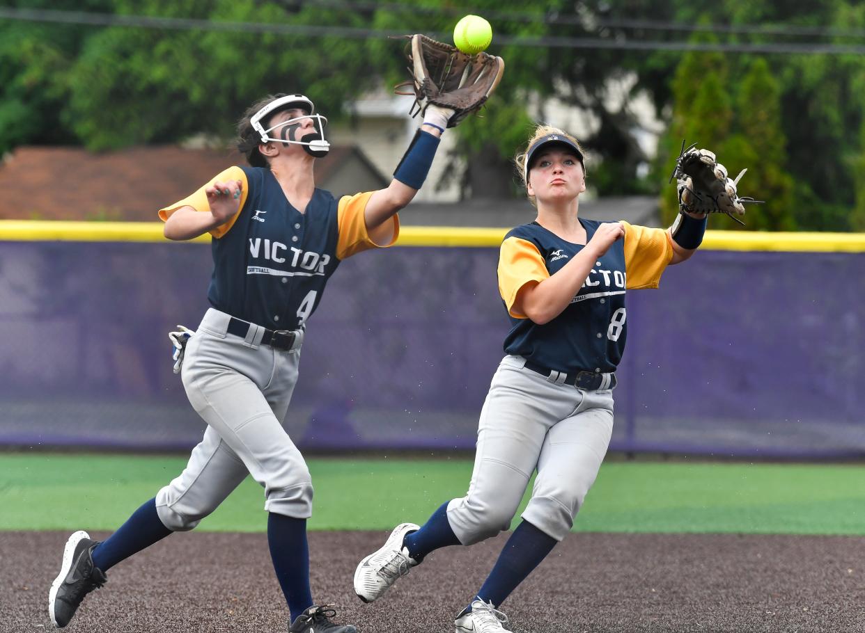 Victor's Ashley Jedrich, left, makes an out as Audrey Steinorth backs up the play during the Section V Class AA Championship at Greece Odyssey High School, Saturday, May 28, 2022. No. 1 seed Fairport won the AA title with a 2-1 win over No. 2 seed Victor.