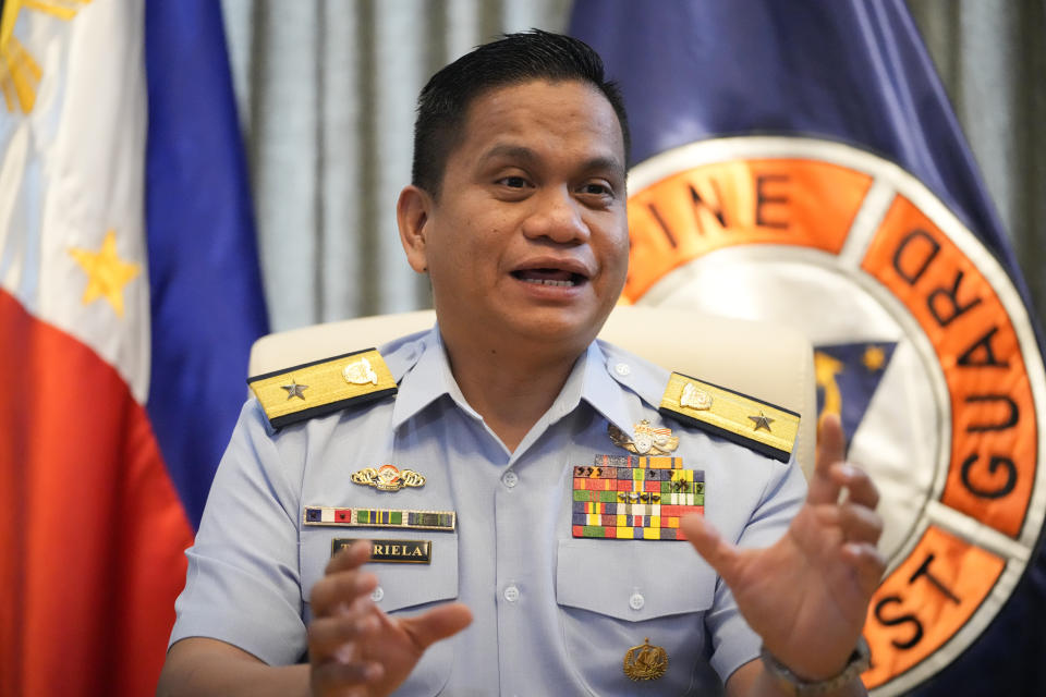 Philippine coast guard spokesman Commodore Jay Tarriela gestures as he talks to reporters during an interview in Manila, Philippines, on Tuesday, Jan. 23, 2024. A Filipino fishing boat captain said Tuesday that he asserted Philippine sovereign rights in a tense confrontation with Chinese authorities in the disputed South China Sea in a new spat that is testing efforts by Beijing and Manila to deescalate tensions in a potential Asian flashpoint. (AP Photo/Aaron Favila)