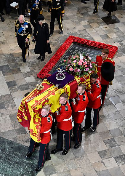 LONDON, ENGLAND - SEPTEMBER 19: King Charles III and Camilla, Queen Consort walk alongside the coffin carrying Queen Elizabeth II as it departs Westminster Abbey on September 19, 2022 in London, England. Elizabeth Alexandra Mary Windsor was born in Bruton Street, Mayfair, London on 21 April 1926. She married Prince Philip in 1947 and ascended the throne of the United Kingdom and Commonwealth on 6 February 1952 after the death of her Father, King George VI. Queen Elizabeth II died at Balmoral Castle in Scotland on September 8, 2022, and is succeeded by her eldest son, King Charles III.  (Photo by Gareth Cattermole/Getty Images)