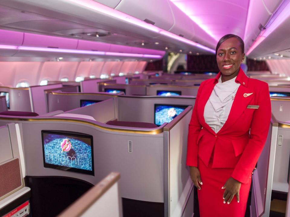 Virgin Atlantic flight attendant in the Upper Class.