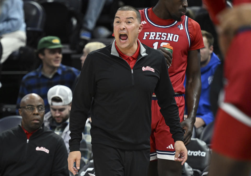 Fresno State head coach Justin Hutson yells at his players during an NCAA college basketball game against BYU in Salt Lake City, Friday, Dec. 1, 2023. (Scott G Winterton/The Deseret News via AP)