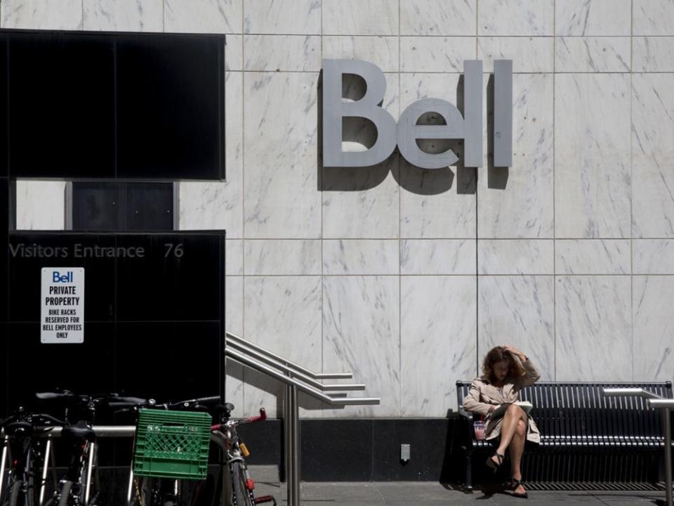  A women outside a Bell Canada office in Toronto.