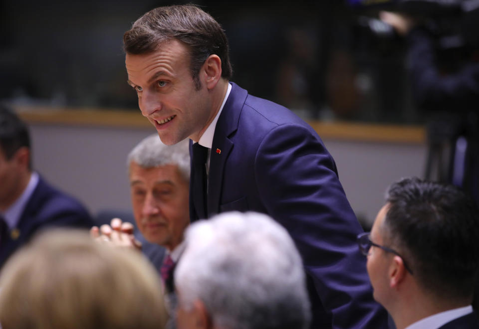 French President Emmanuel Macron attends a round table meeting at an EU summit at the European Council building in Brussels, Friday, Feb. 21, 2020. In a second day of meetings EU leaders will continue to discuss the bloc's budget to work out Europe's spending plans for the next seven years. (AP Photo/Olivier Matthys)