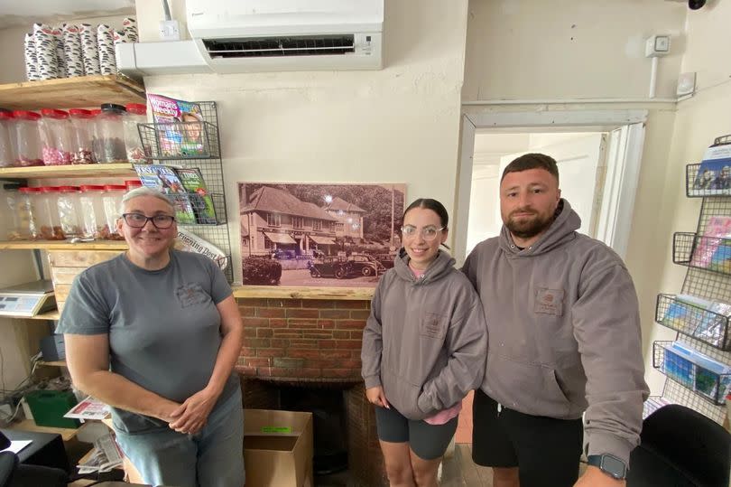 It is steeped in history. Caroline Rutter, Carla Humphreys and Luke Borrelli stand next to a picture of how it originally looked -Credit:WalesOnline