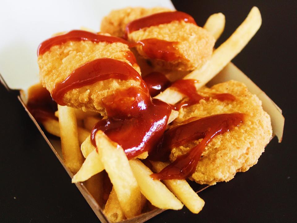 mcdonalds chicken nuggets and fries covered in bbq sauce