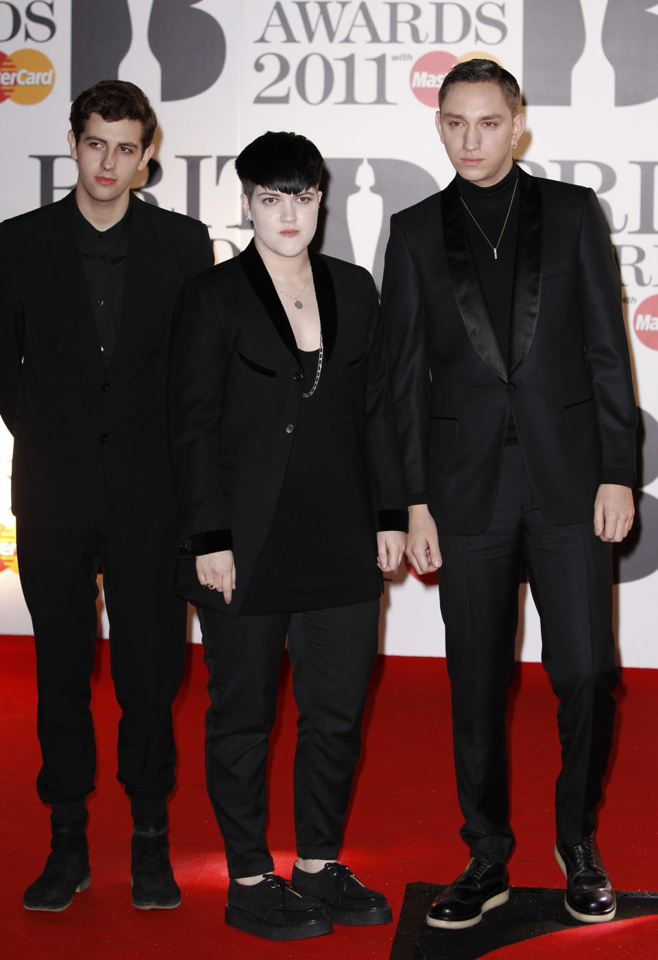 FILE - This Feb. 15, 2011 file photo shows, from left, Oliver Sim, Romy Madley Croft and Jamie Smith of The XX at the Brit Awards 2011 at The O2 Arena in London. The XX is part of a breed of newer and lesser known acts who are able to sell out top venues, even if they aren’t selling millions of albums and singles, or dominating with chart-topping tracks and radio airplay.(AP Photo/Joel Ryan, File)