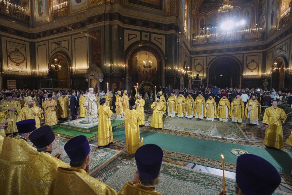 In this photo released by Russian Orthodox Church Press Service, Russian Orthodox Patriarch Kirill, background left, delivers the Christmas service in the Christ the Saviour Cathedral in Moscow, Russia, on Saturday, Jan. 6, 2024. While much of the world has Christmas in the rearview mirror by now, people in some Eastern Orthodox traditions arecelebrating the holy day on Sunday, Jan. 7. (Oleg Varov, Russian Orthodox Church Press Service via AP)