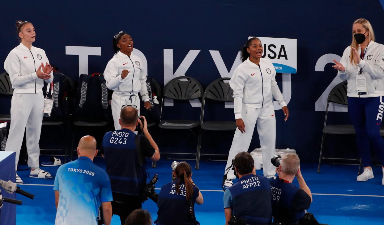 Athletes from the USA support their teammate Simon Biles during the Artistic Gymnastics Women Final of the Tokyo 2020 Olympic Games at the Ariake? Gymnastics Centre in Tokyo, Japan, 27 July 2021 (EPA)