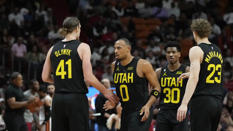 Utah Jazz guard Talen Horton-Tucker (0) celebrates with forward Kelly Olynyk (41), guard Ochai Agbaji (30) and forward Lauri Markkanen (23), during the first half of an NBA basketball game against the Miami Heat, Monday, March 13, 2023, in Miami. 