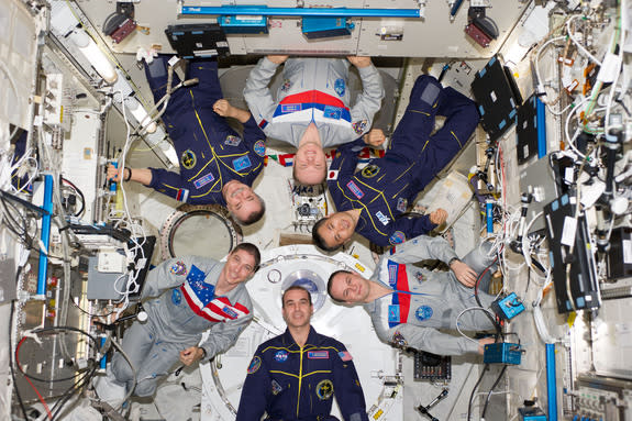 The Expedition 38 crew of the International Space Station poses for an in-flight crew portrait in the Kibo laboratory of the International Space Station on Feb. 22, 2014.