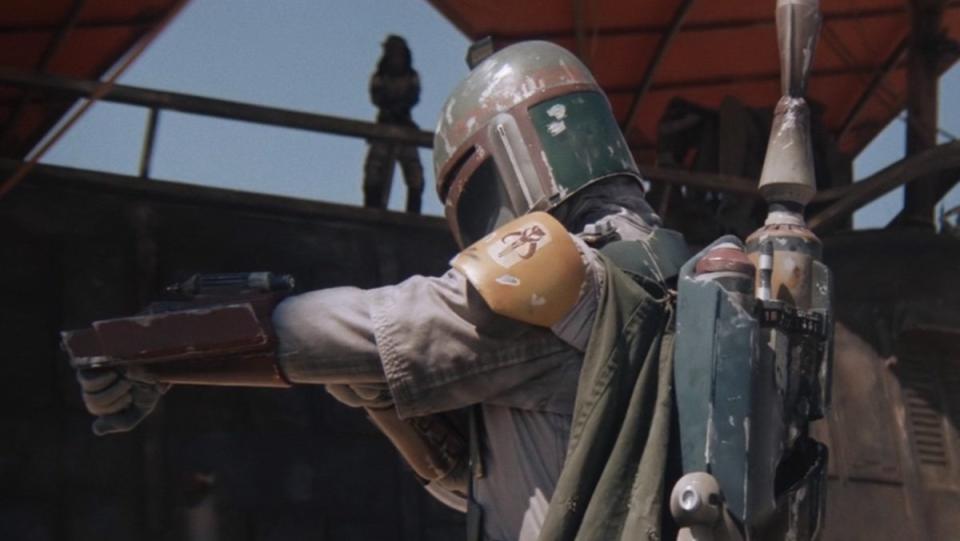 Boba Fett points his arm to fire during the battle of Jabba's barge in Return of the Jedi