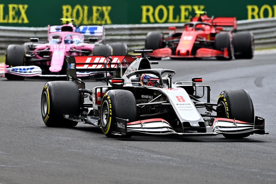 Haas F1's French driver Romain Grosjean steers his car in front of Racing Point's Canadian driver Lance Stroll and Ferrari's Monegasque driver Charles Leclerc during the Formula One Hungarian Grand Prix race at the Hungaroring circuit in Mogyorod near Budapest, Hungary, on July 19, 2020. (Photo by Joe Klamar / POOL / AFP) (Photo by JOE KLAMAR/POOL/AFP via Getty Images)