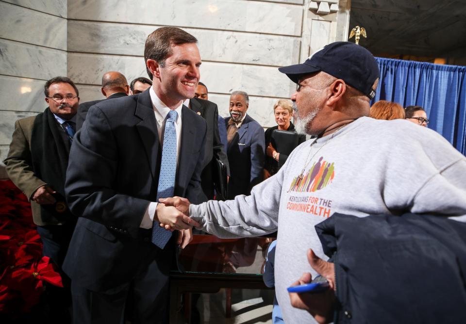 Juan Gomez shakes the hand of Gov. Andy Beshear after the Governor signed an executive order to restore the voting rights of around 140,000 non-violent felons. Gomez was convicted of burglary 15 years ago and served two years. "I believe in the law," Gov. Andy Beshear said. "I also believe in second chances." Dec. 12, 2019