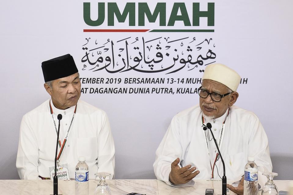 Umno president Datuk Seri Zahid Hamidi (left) and PAS president Datuk Seri Abdul Hadi Awang at the Himpunan Penyatuan Ummah (Muslim Unity Rally) at the Putra World Trade Centre September 14, 2019. — Picture by Miera Zulyana