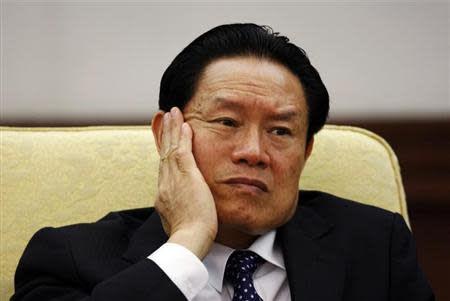 Then China's Public Security Minister Zhou Yongkang reacts as he attends the Hebei delegation discussion sessions at the 17th National Congress of the Communist Party of China at the Great Hall of the People, in Beijing October 16, 2007. REUTERS/Jason Lee