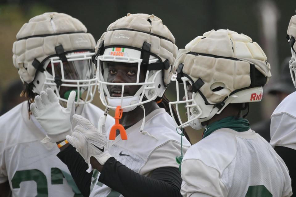 Florida A&M University linebacker Nadarius Fagan (middle) rallies the defense during fall training camp, Aug. 18, 2022