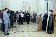 Iran's outgoing President Rouhani and Iran's President-elect Raisi speak to the media after their meeting, in Tehran