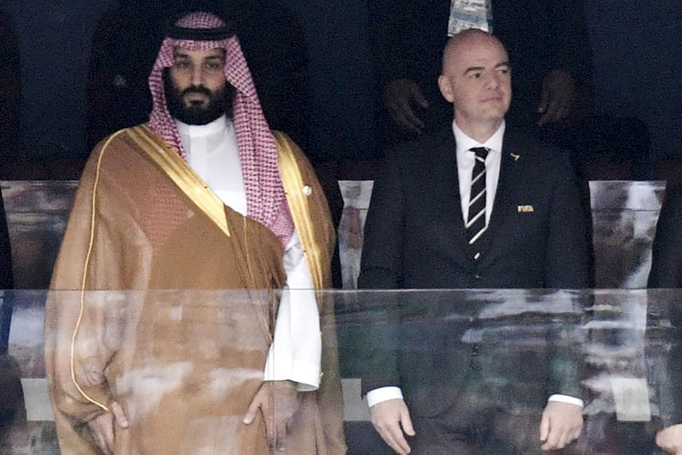 FILE - Saudi Arabia Crown Prince Mohammed bin Salman, left, and FIFA President Gianni Infantino, stand for the anthem prior to the match between Russia and Saudi Arabia which opened the 2018 soccer World Cup at the Luzhniki stadium in Moscow, Russia, on June 14, 2018. A complaint alleging abuses of migrant workers in Saudi Arabia was filed with the UN-backed International Labor Organization on Wednesday, June 5, 2024, as FIFA prepares to confirm the oil-rich kingdom as host of the 2034 World Cup. (Alexei Nikolsky, Sputnik, Kremlin Pool Photo via AP, File)