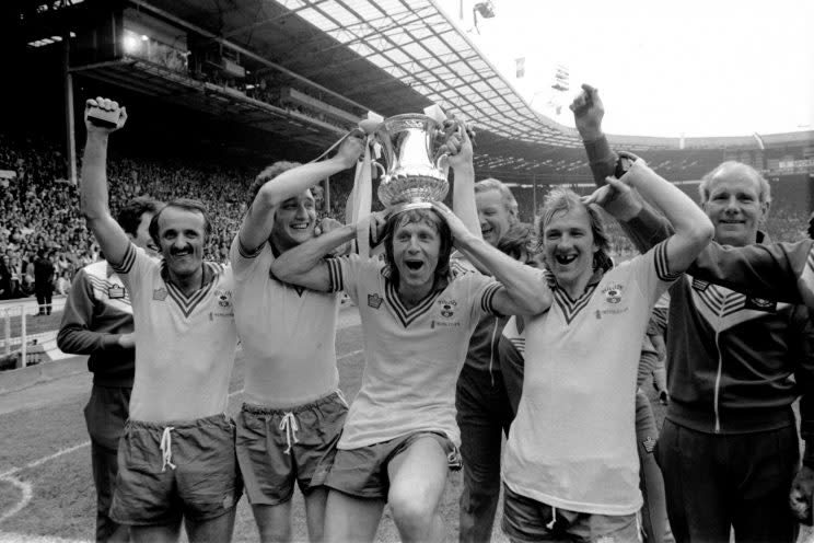Southampton’s Peter Rodrigues, Jim Steele, Mel Blyth and David Peach celebrate with the FA Cup after their 1-0 win over Manchester United at Wembley