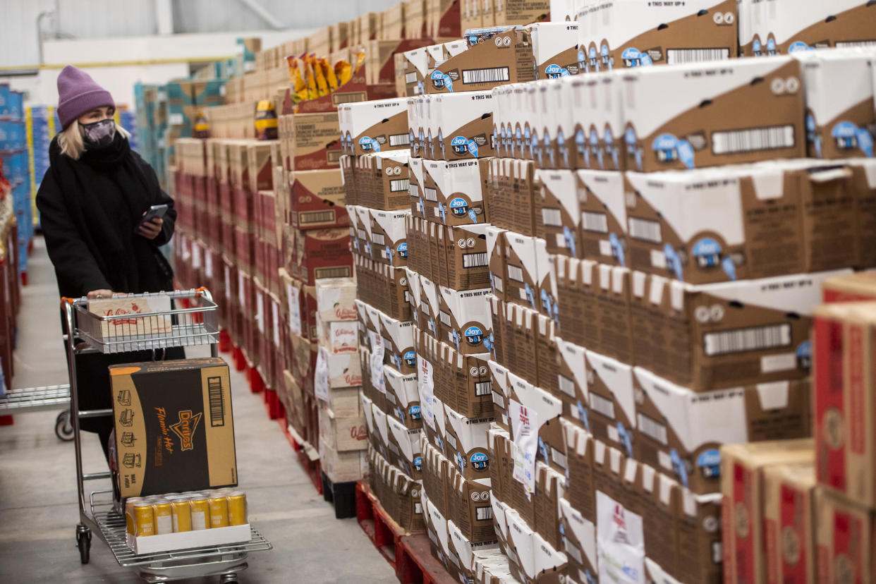 Shoppers at Rogers Wholesale, a supermarket which only sells food that's past its Best Before date, in Stockport, England. Photo: Anthony Devlin/Getty Images