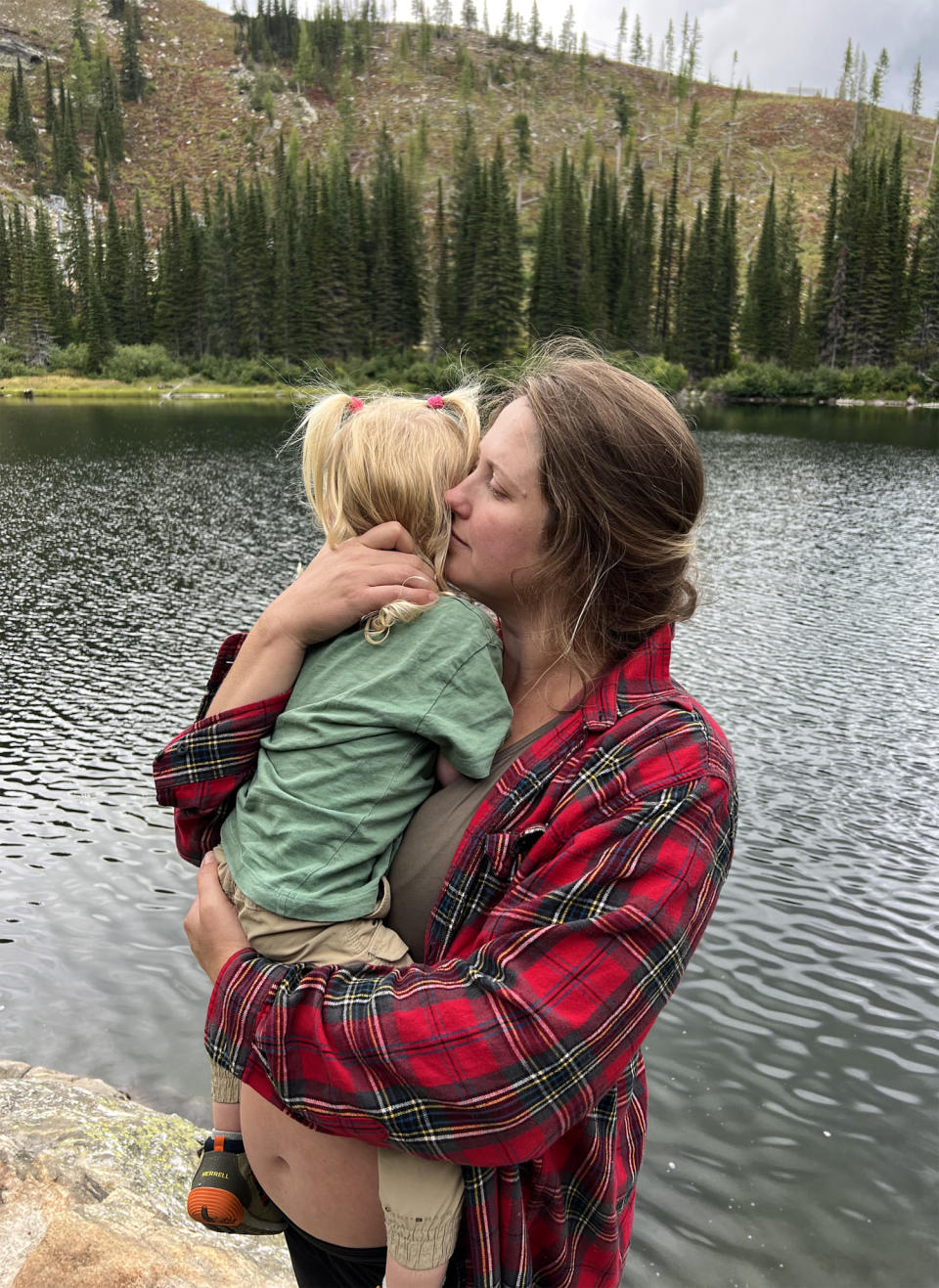 Image: Lauren Sanders, six months pregnant, holds her daughter, 2 and a half. (Courtesy Madison Sanders)