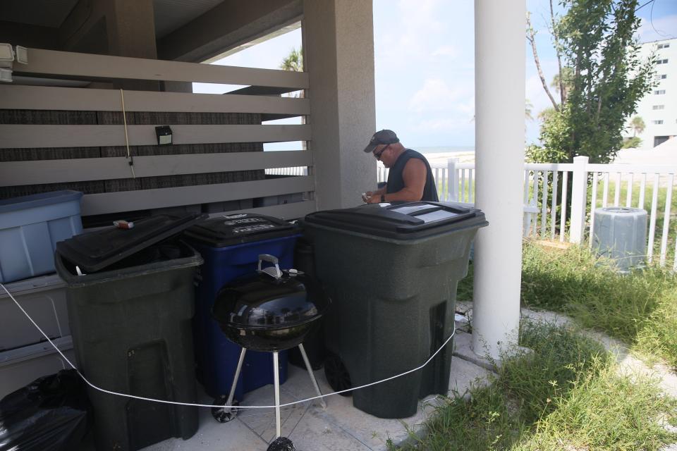 Paul ÒBruiserÓJungwirth, an employee of JPS Vacation Rentals secures items at a home on Fort Myers Beach, Florida on Monday, Aug. 28, 2023. Tropical Storm Idalia is approaching the state and is expected to be a hurricane by landfall. He said a lot of the homes that were represented by the company are now destroyed due to Hurricane Ian from last year. He says only a couple of homes are left.