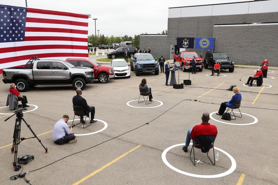 With his audience of union leadership and journalists socially distanced to reduce the risk posed by the coronavirus, Democratic nominee  Joe Biden delivers remarks in the parking lot outside the United Auto Workers Region 1 offices Sept. 9 in Warren, Mich.