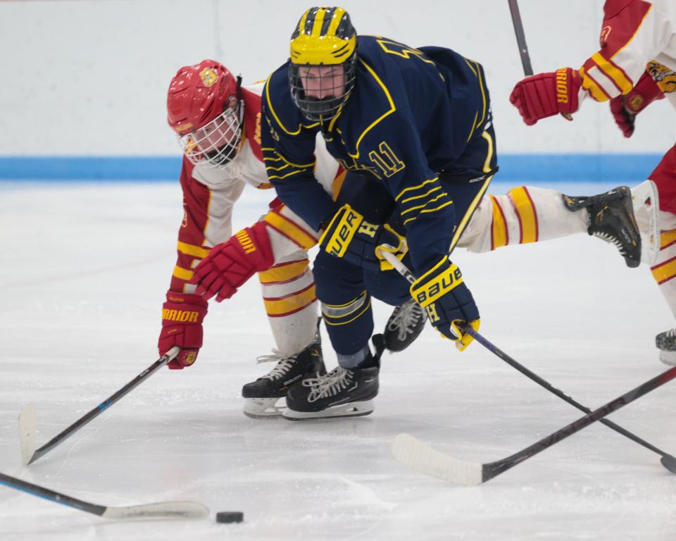 Ty Kraut (11) was one of three Hartland hockey players who scored their first varsity goals during a trip to the Upper Peninsula.